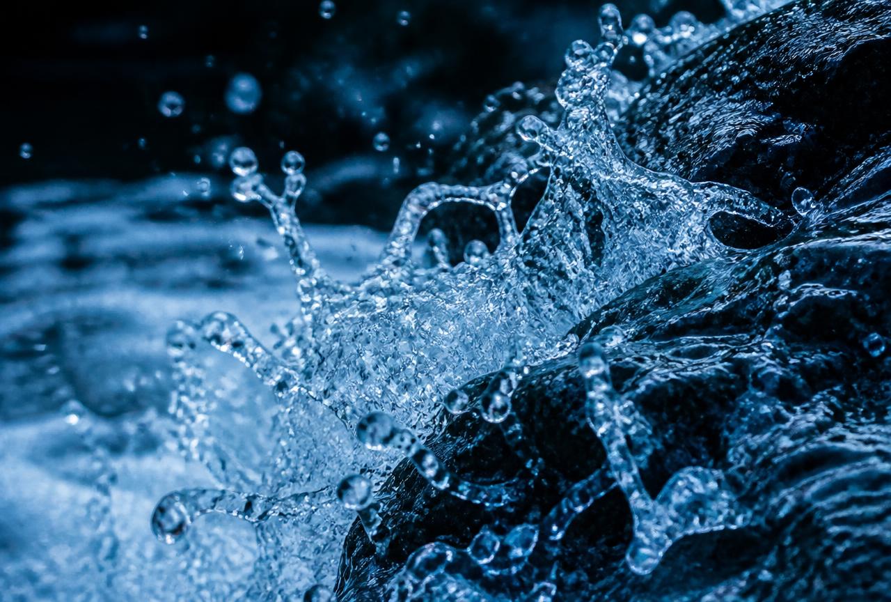 Spring water splashing over rock